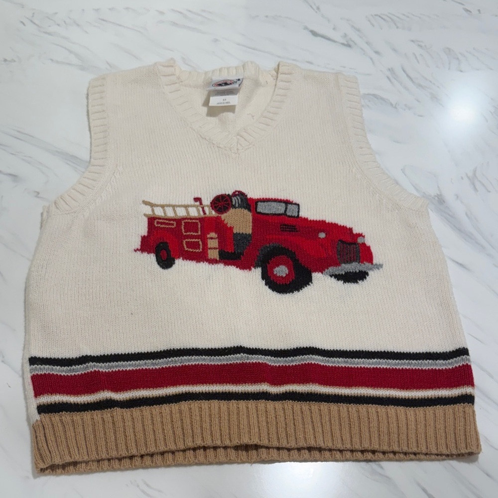 Goodl Lad vest with fire truck design on front in size 5. Excellent condition.